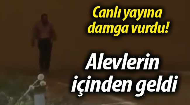 Bir anda alevlerin içinden çıkıp geldi